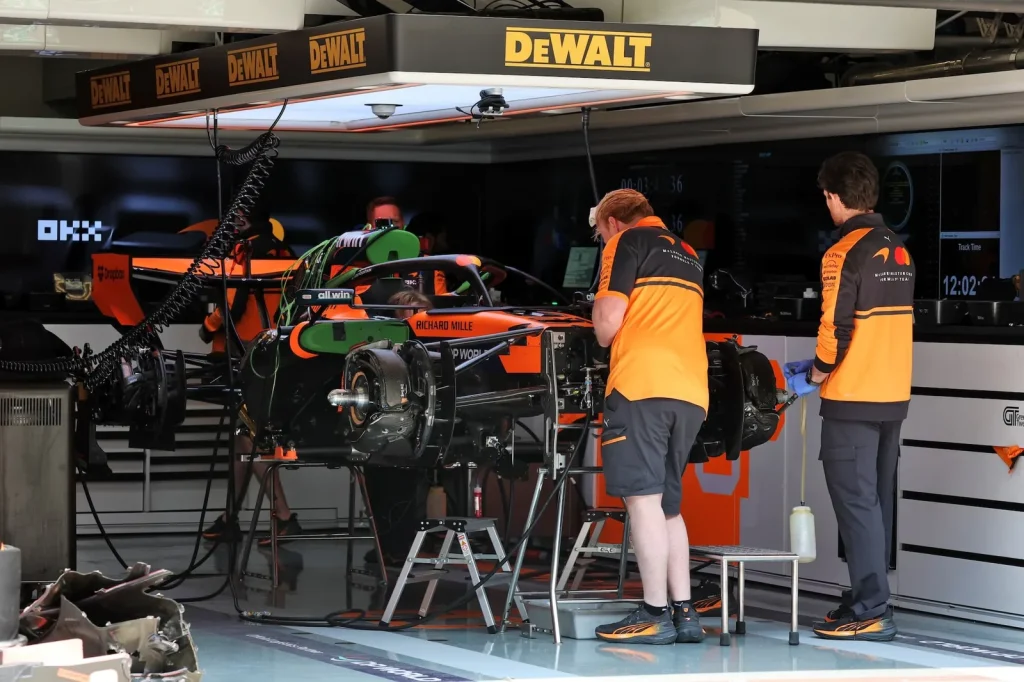 McLaren F1 Team MCL40 being prepared in the pit garage.
