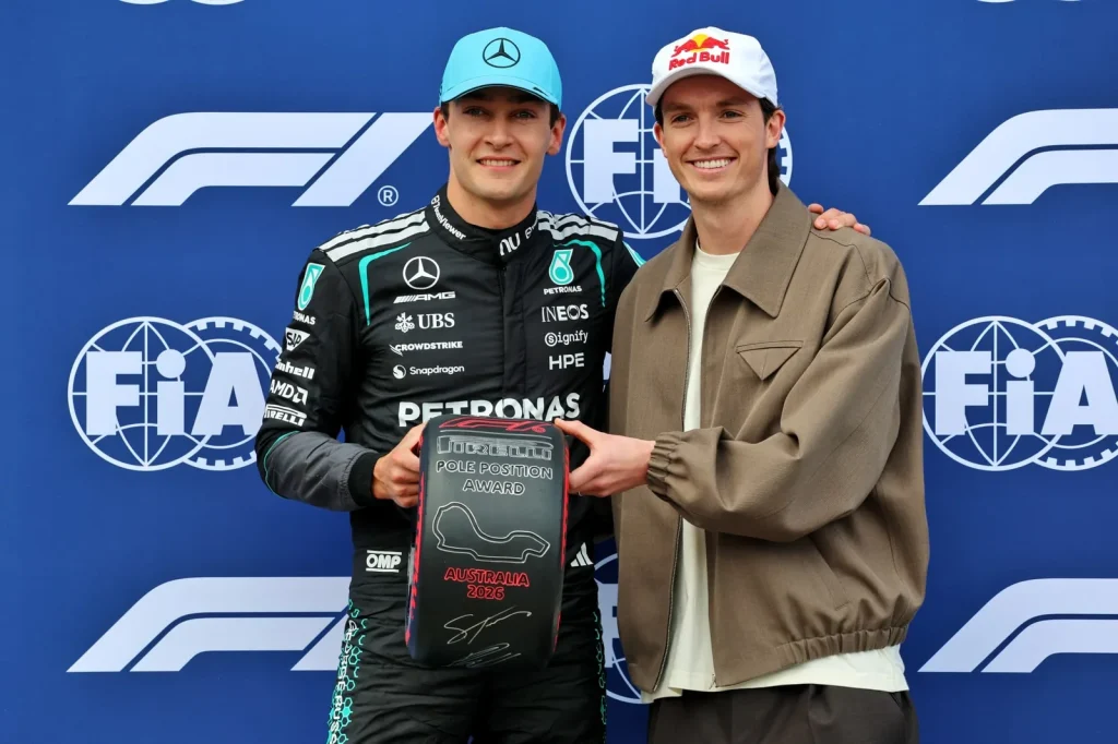 (L to R): George Russell (GBR) Mercedes AMG Formula One Team receives the Pirelli Pole Position Award from Scotty James (AUS) Snowboarder in qualifying parc ferme.