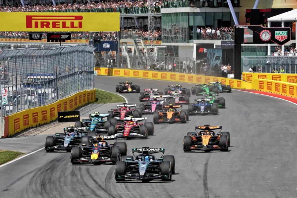 George Russell (GBR) Mercedes AMG F1 W16 leads at the start of the race.