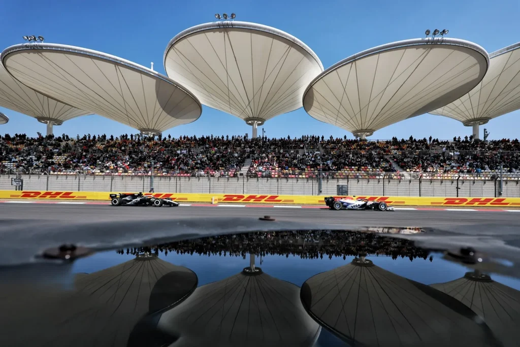 Liam Lawson (NZL) Racing Bulls Formula One Team VCARB 03 and Sergio Perez (MEX) Cadillac Formula 1 Team MAC-26.