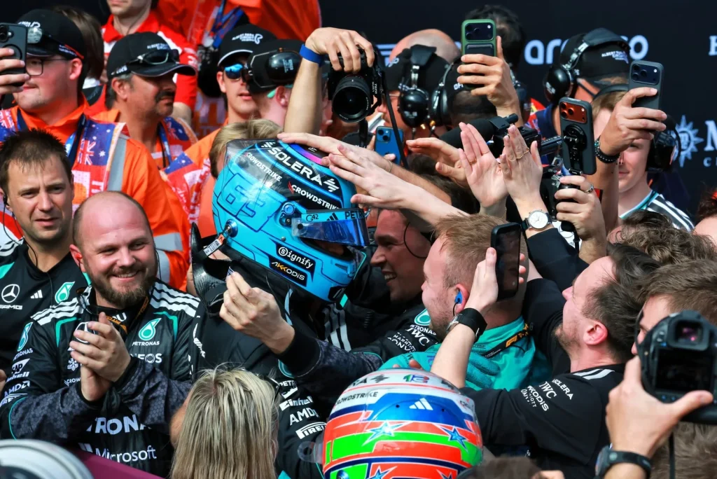 Race winner George Russell (GBR) Mercedes AMG Formula One Team celebrates in parc ferme with the team.