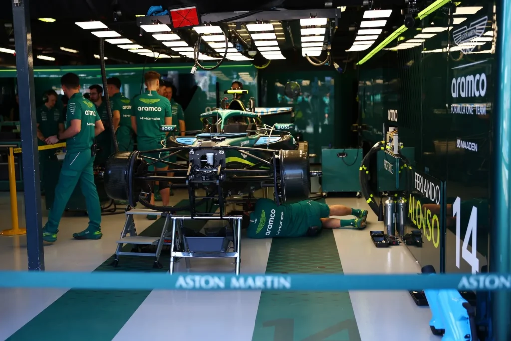 Aston Martin F1 Team AMR26 of Fernando Alonso (ESP) worked on by mechanics.