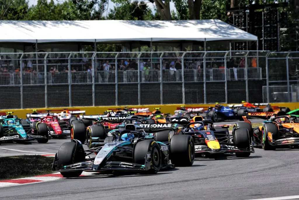 George Russell (GBR) Mercedes AMG F1 W16 leads at the start of the race.