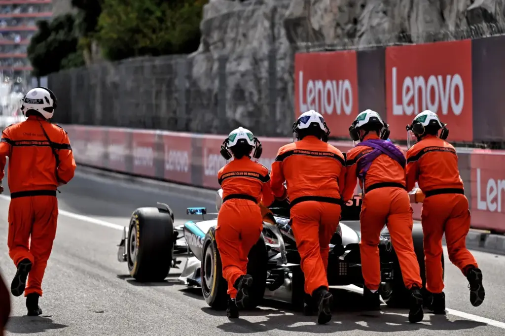 George Russell (GBR) Mercedes AMG F1 W16 is pushed to safety by marshals after he stopped in the tunnel during qualifying.