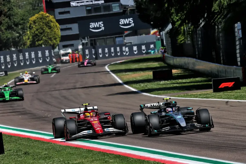 Lewis Hamilton (GBR) Ferrari SF-25 and Andrea Kimi Antonelli (ITA) Mercedes AMG F1 W16 battle for position.