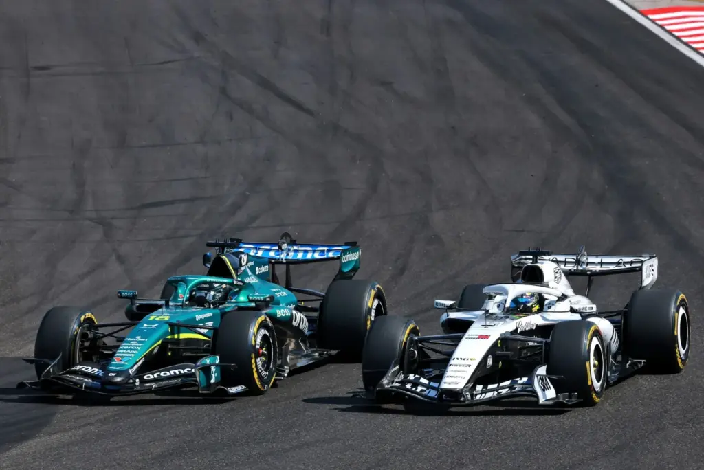 Lance Stroll (CDN) Aston Martin F1 Team AMR26 and Sergio Perez (MEX) Cadillac Formula 1 Team MAC-26 battle for position.