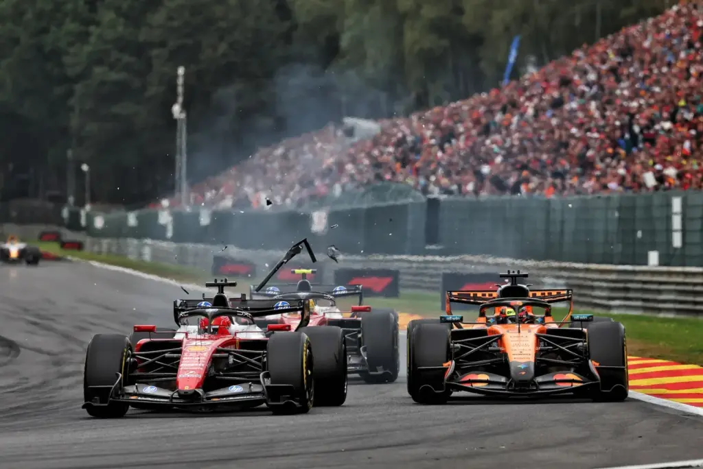 Charles Leclerc (MON) Scuderia Ferrari SF-26 and Oscar Piastri (AUS) McLaren F1 Team MCL40 make contact.