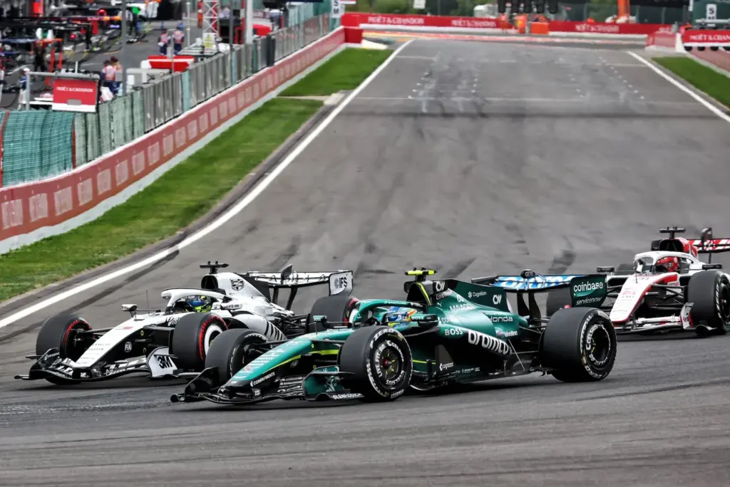 Sergio Perez (MEX) Cadillac Formula 1 Team MAC-26 and Fernando Alonso (ESP) Aston Martin F1 Team AMR26 battle for position.