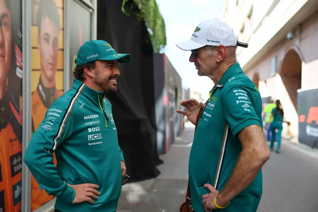MONTE-CARLO, MONACO - MAY 22: Fernando Alonso of Spain and Aston Martin F1 Team and Adrian Newey, Managing Technical Partner of Aston Martin F1 talk in the Paddock during previews ahead of the F1 Grand Prix of Monaco at Circuit de Monaco on May 22, 2025 in Monte-Carlo, Monaco. (Photo by Zak Mauger/LAT Images)