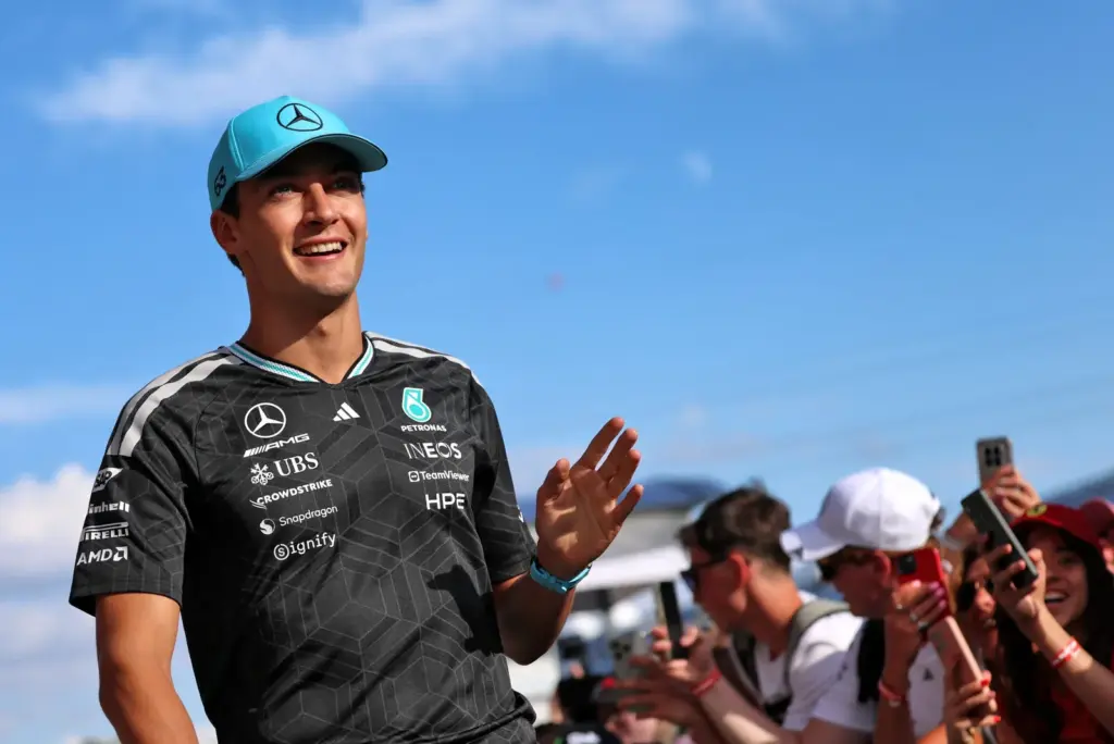 George Russell (GBR) Mercedes AMG Formula One Team with fans.