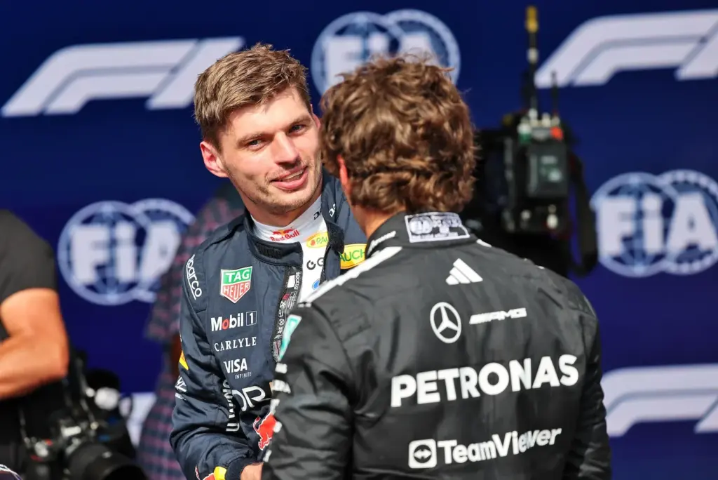Max Verstappen (NLD) Red Bull Racing and Andrea Kimi Antonelli (ITA) Mercedes AMG Formula One Team in qualifying parc ferme.
