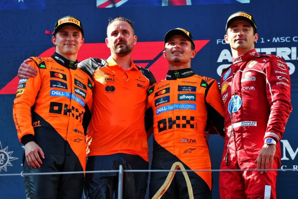 The podium (L to R): Oscar Piastri (AUS) McLaren, second; Neil Houldey (GBR) McLaren Technical Director  Engineering; Lando Norris (GBR) McLaren, race winner Charles Leclerc (MON) Ferrari, third.